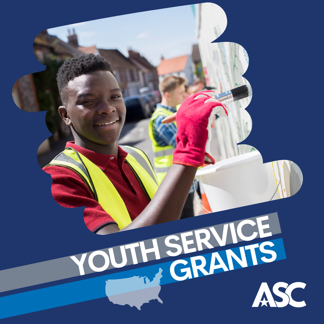 Decorative image. Navy graphic with photo of young person painting an exterior wall. Text reads Youth Service Grants.