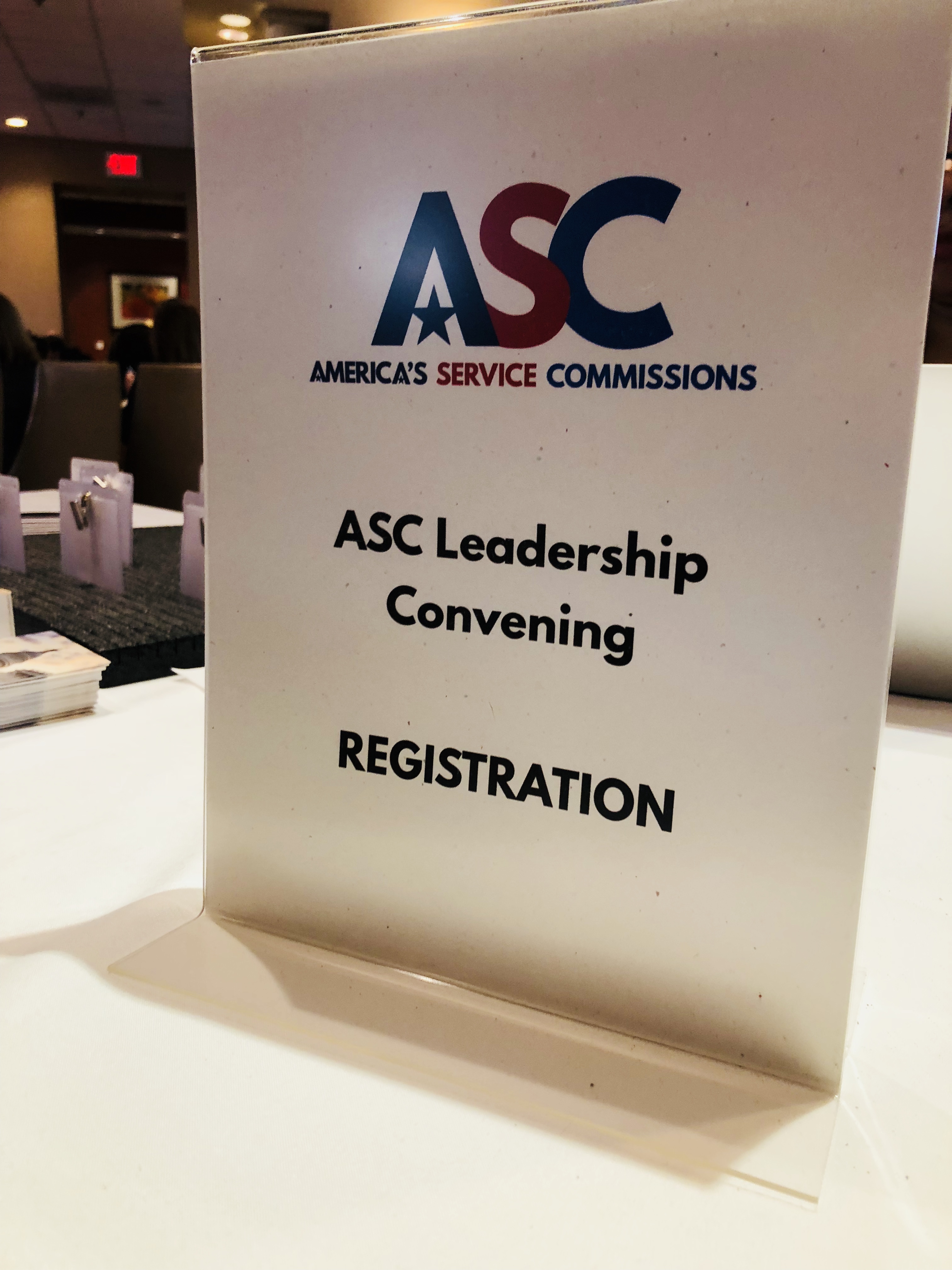 decorative. photo of a sign that has the ASC logo and says ASC Leadership Convening Registration